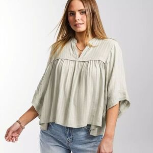 Daytrip sage light green peasant tunic with short sleeves and v neck. Romantic c